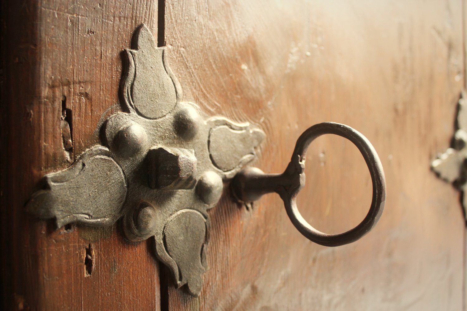 An old key in a wooden synagogue door