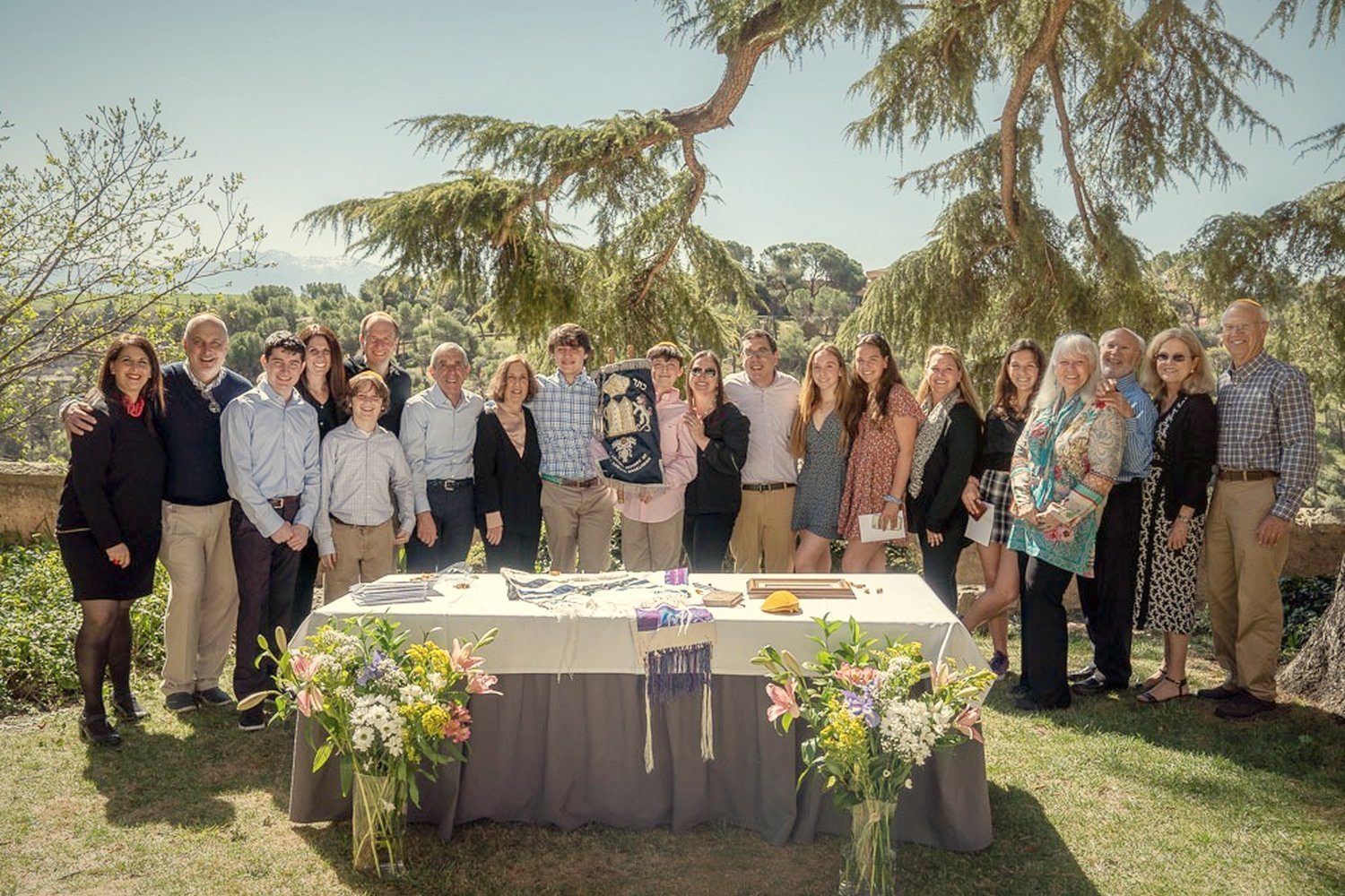 Families gathered for a bar mitzvah in a garden in Segovia