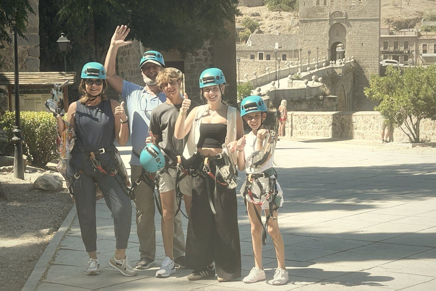 A family in helmets and harnesses after the zip line in Toledo