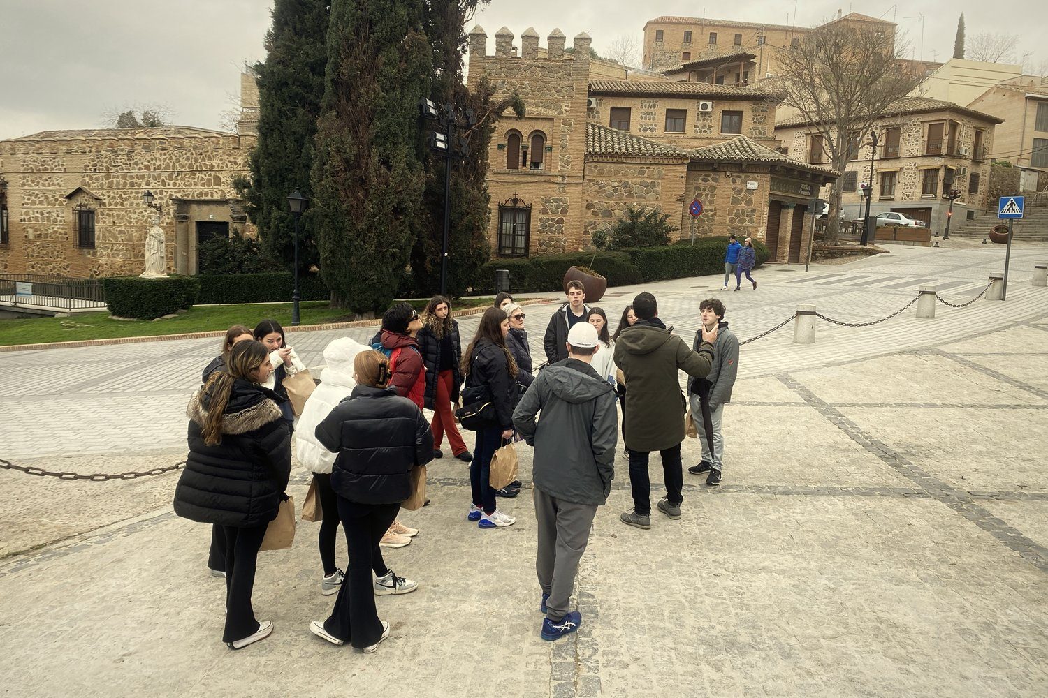 A group listening to a guide in Toledo
