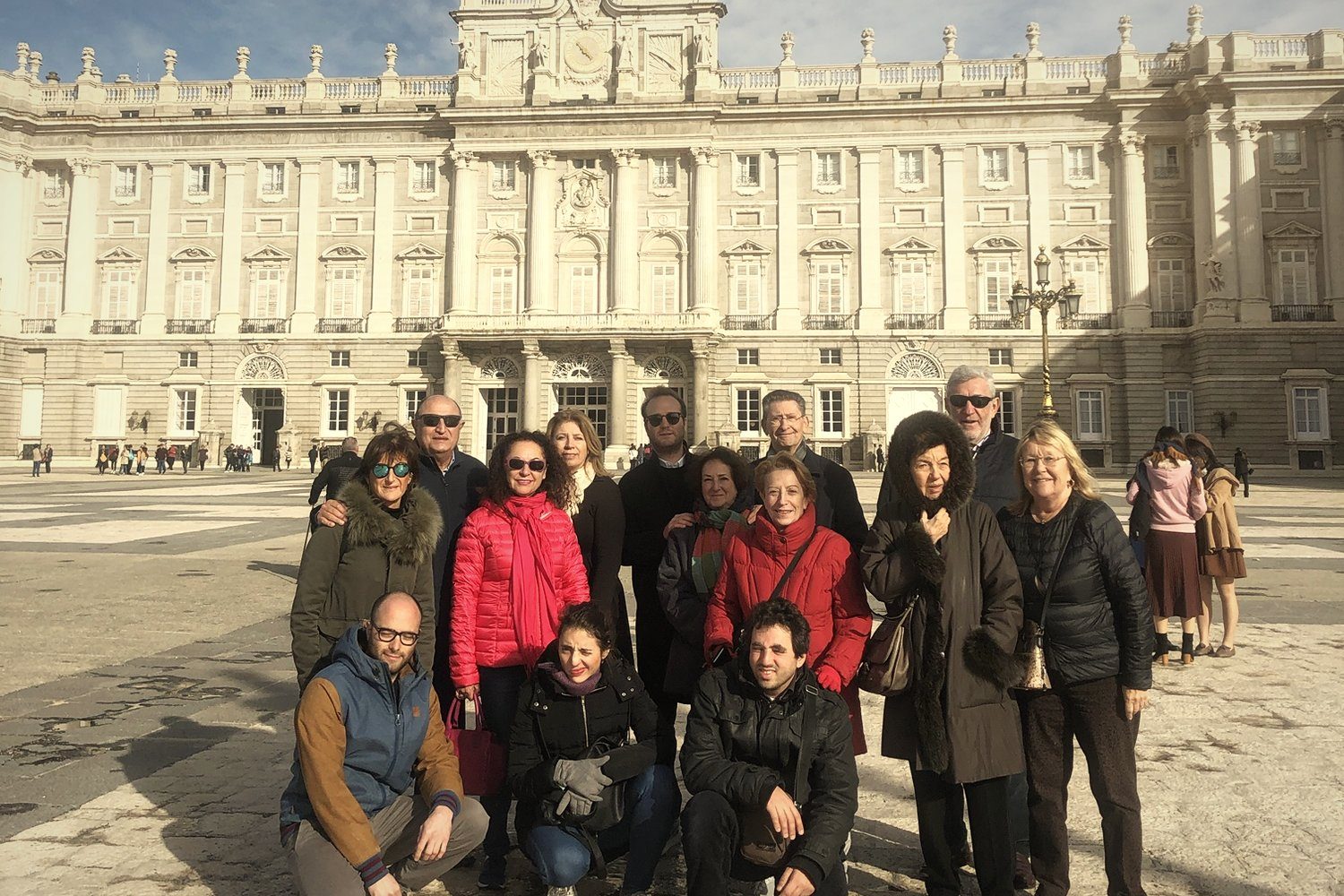 A group in front of the Royal Palace of Madrid