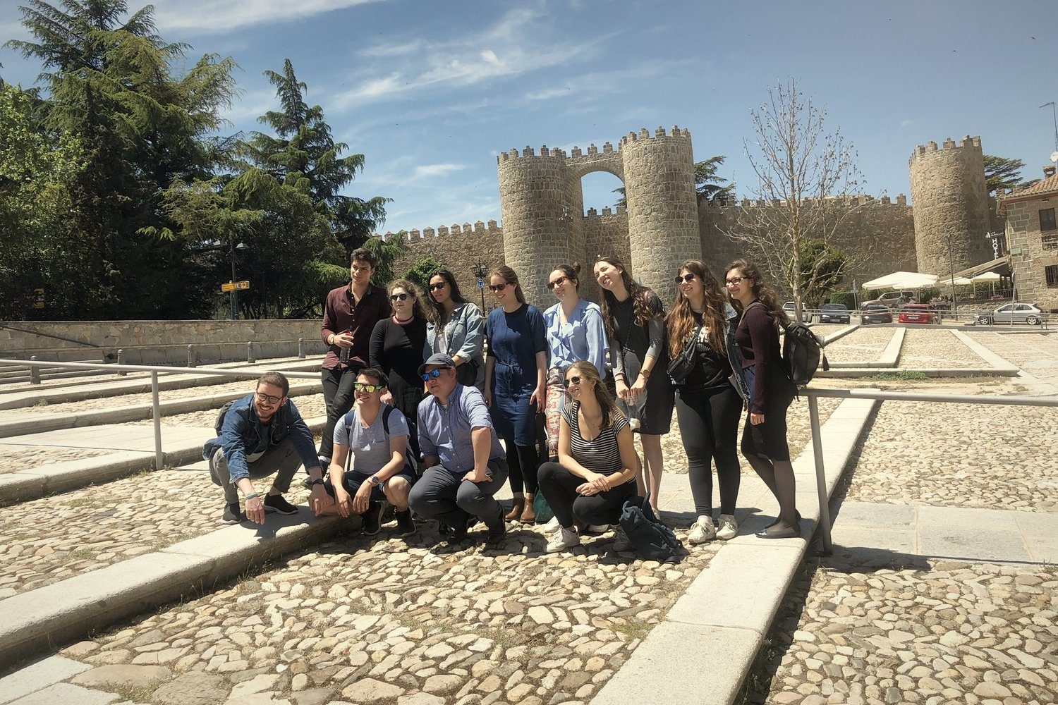 A group in front of the medieval walls of Ávila