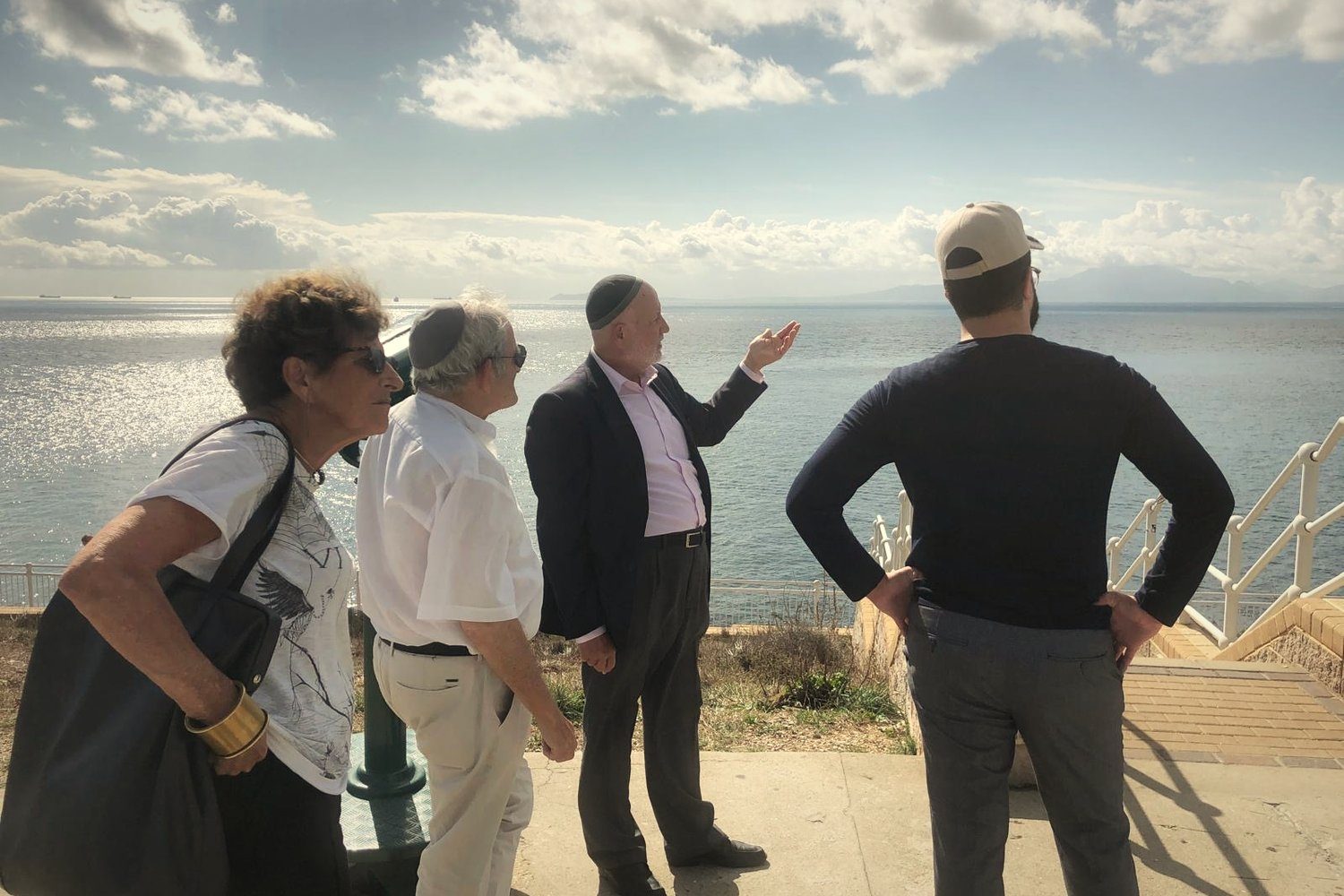 Travellers looking across the Strait of Gibraltar towards Africa